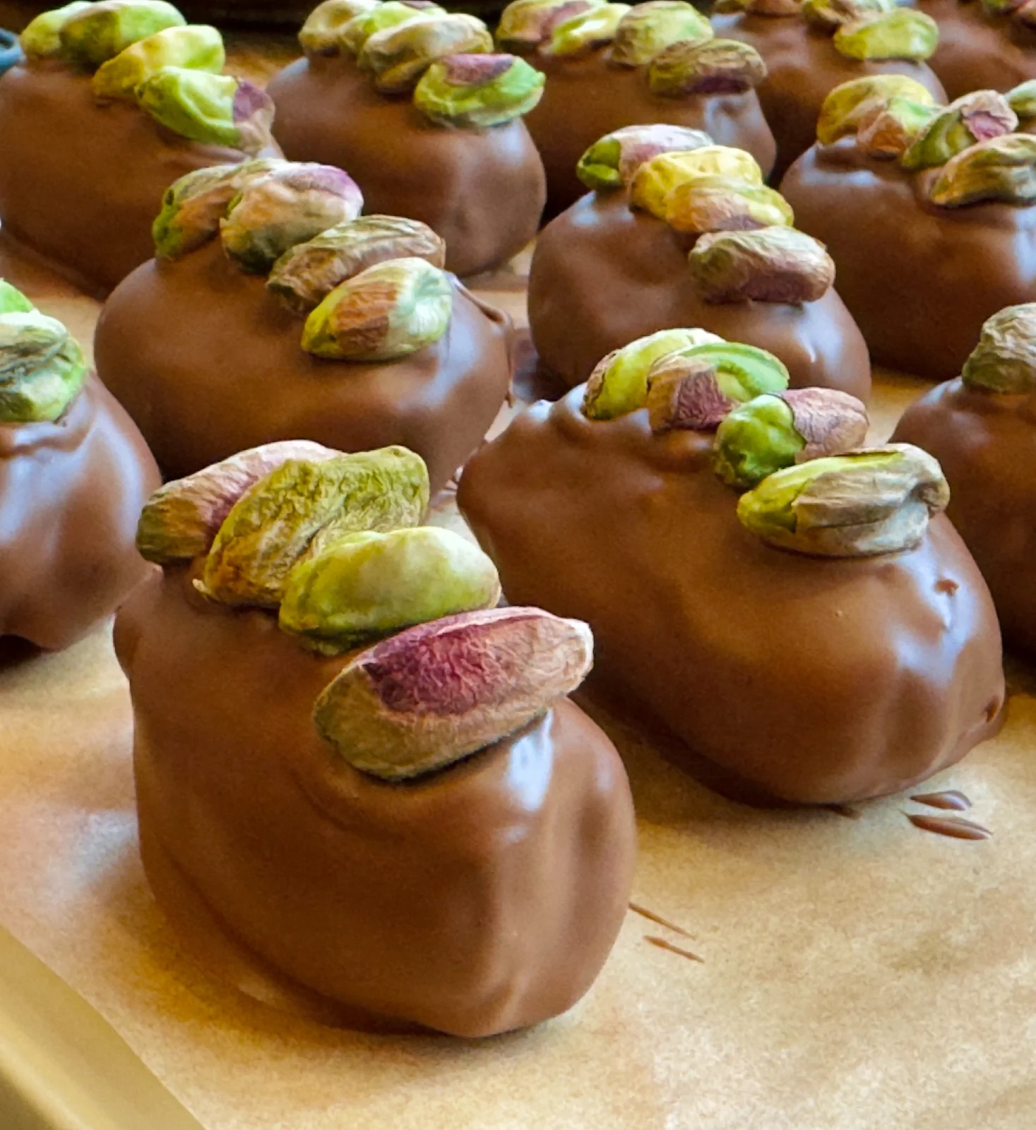 Milk chocolate Bonibon Dubai dates topped with pistachios